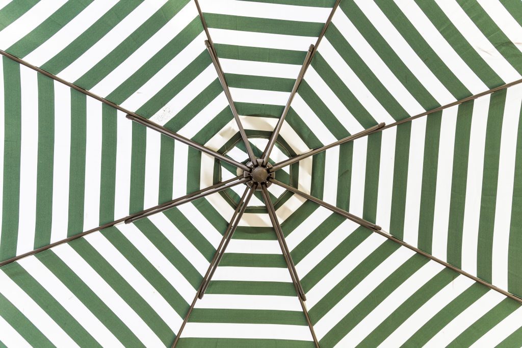 green and white umbrella beach HvYsV1u3zg 1