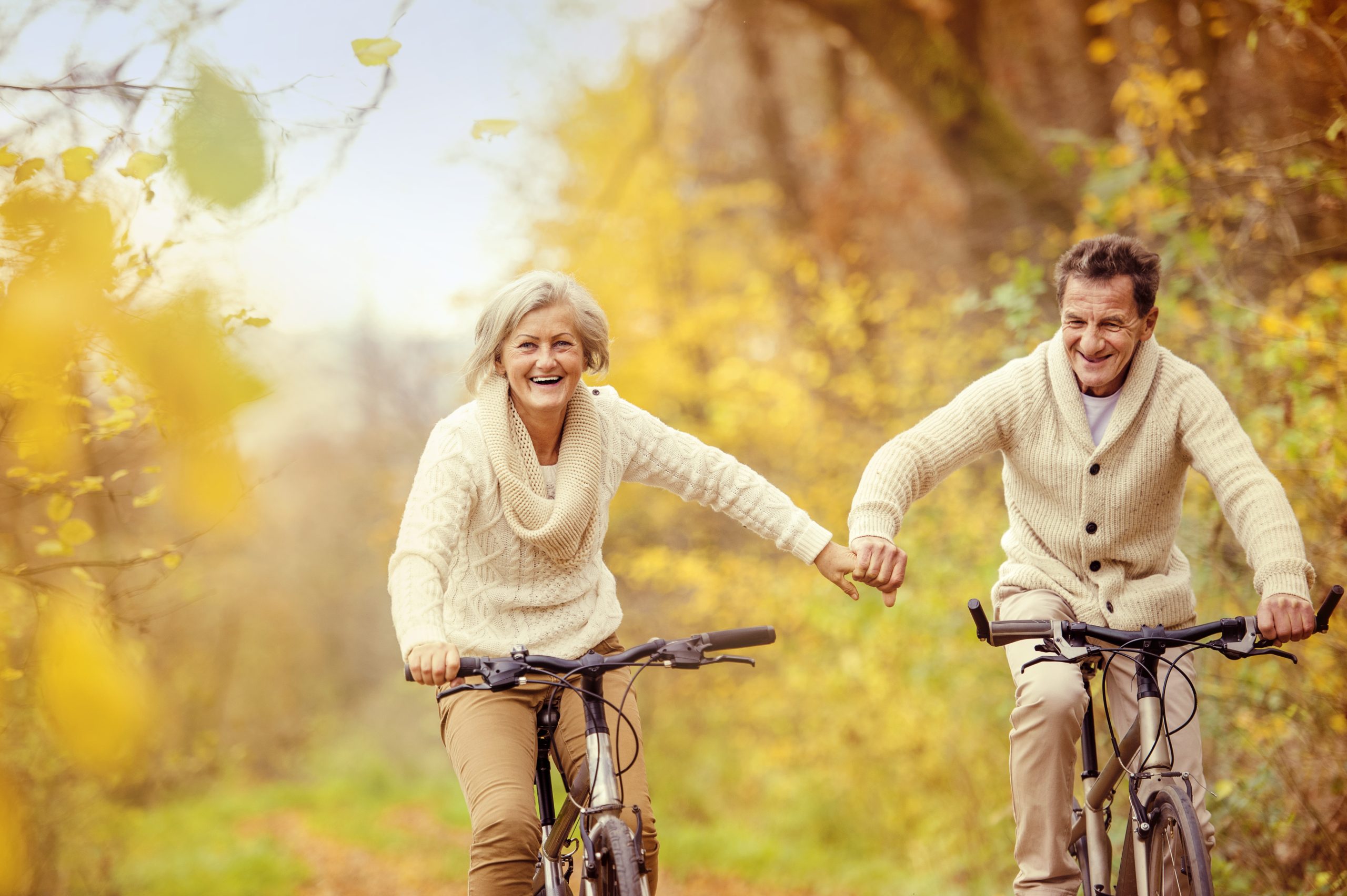 graphicstock active seniors riding bike in autumn nature they relax outdoor BRff51hW scaled
