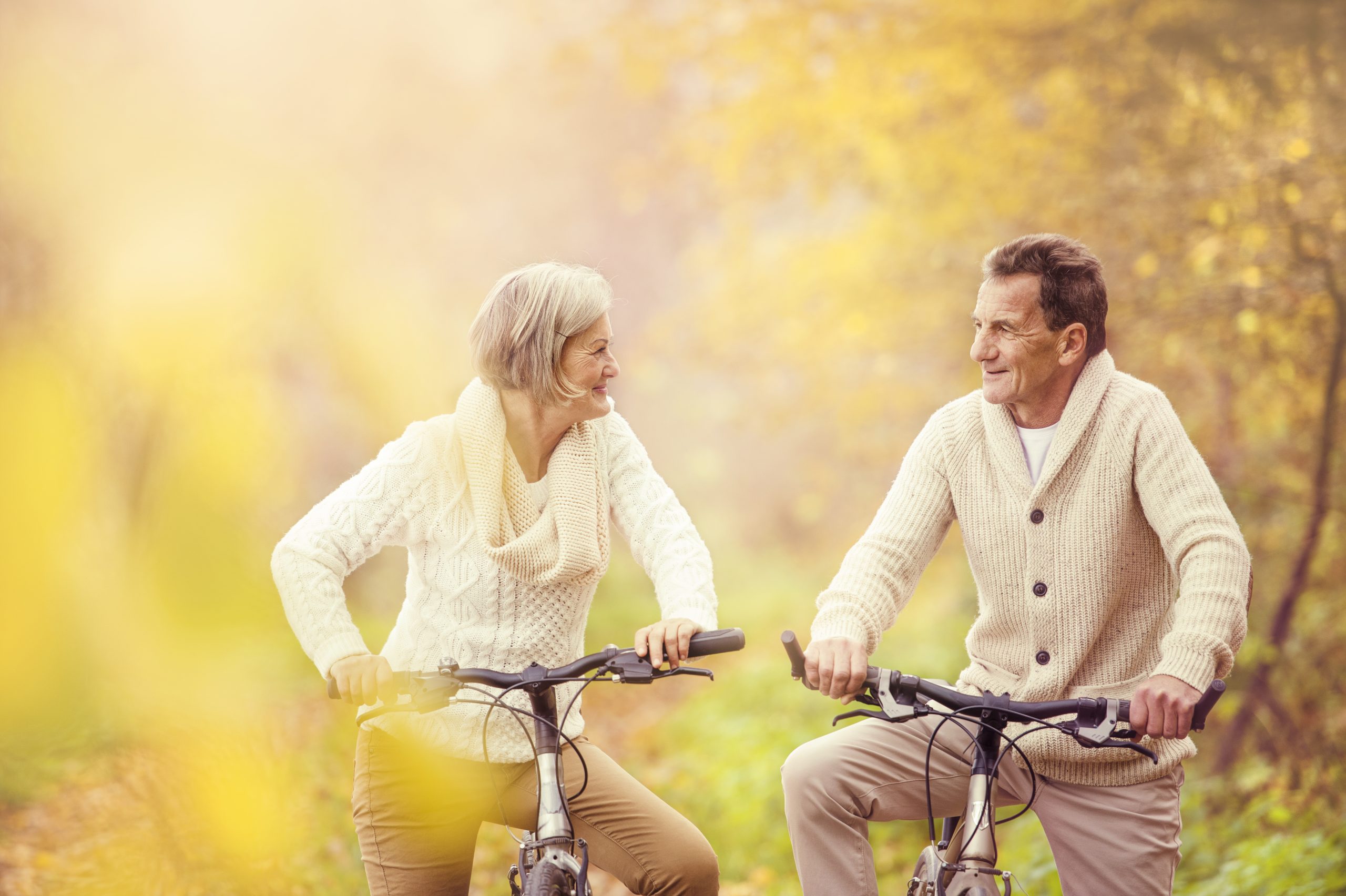 graphicstock active seniors riding bike in autumn nature they relax outdoor SClxEqk3ZW scaled