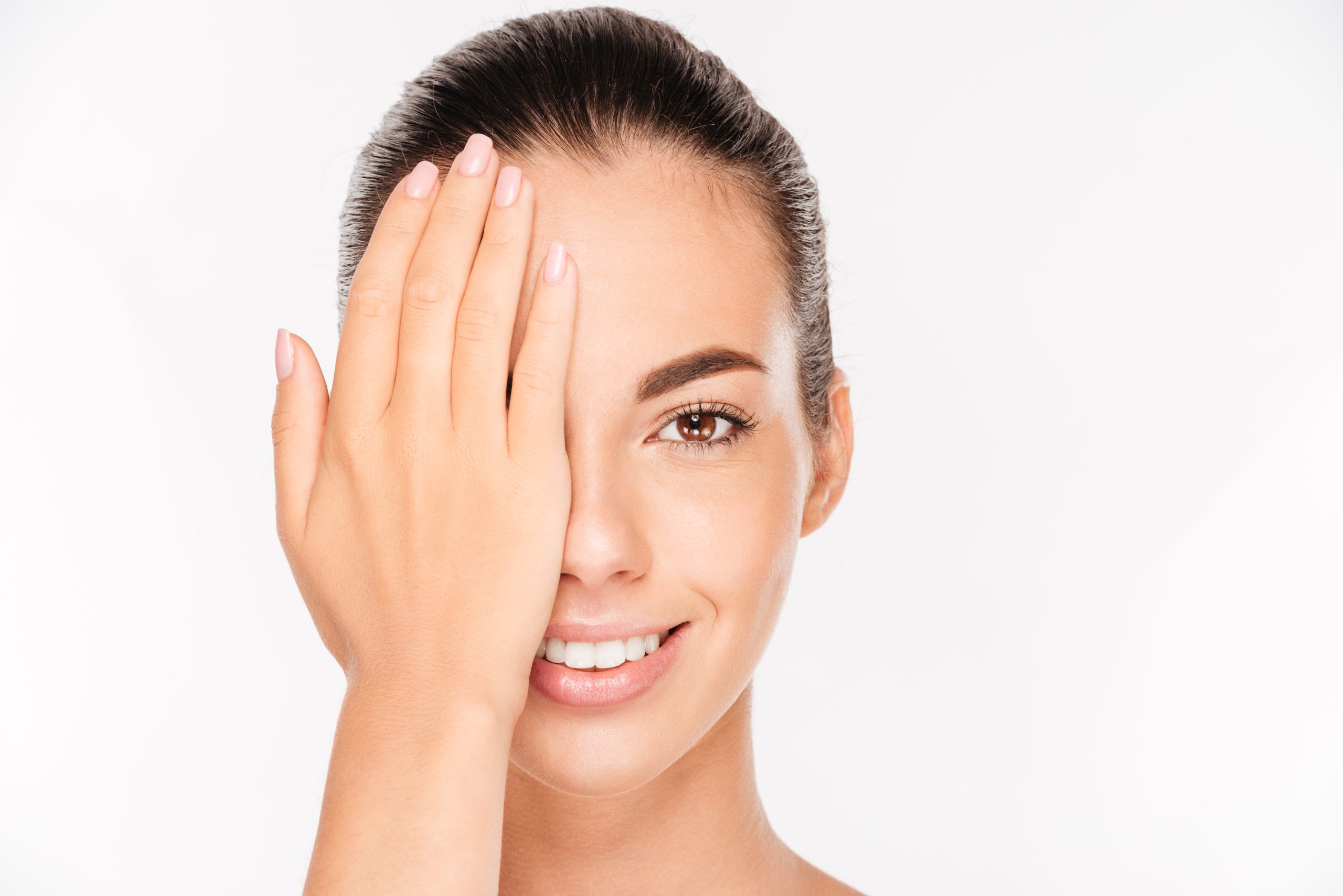 graphicstock beauty portrait of a charming woman with skin care covering face with palm isolated on a white background rOfeQ8E3H3l scaled